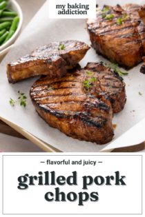 Four grilled pork chops resting on a parchment-lined sheet pan. Text overlay includes recipe name.