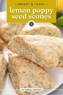 Close up of glazed lemon poppy seed scone propped against a second scone. Text overlay includes recipe name.