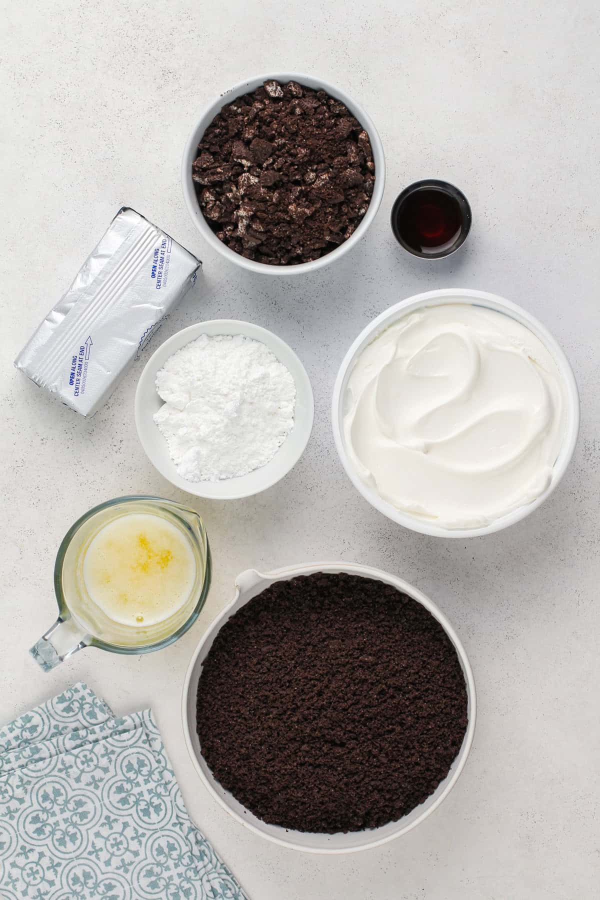 Ingredients for oreo pie arranged on a countertop.