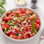 Watermelon feta salad in a white serving bowl.