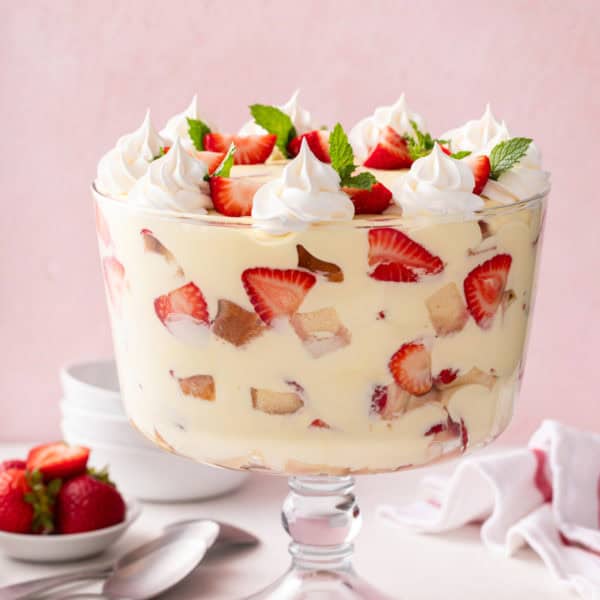 Trifle dish filled with strawberry trifle.