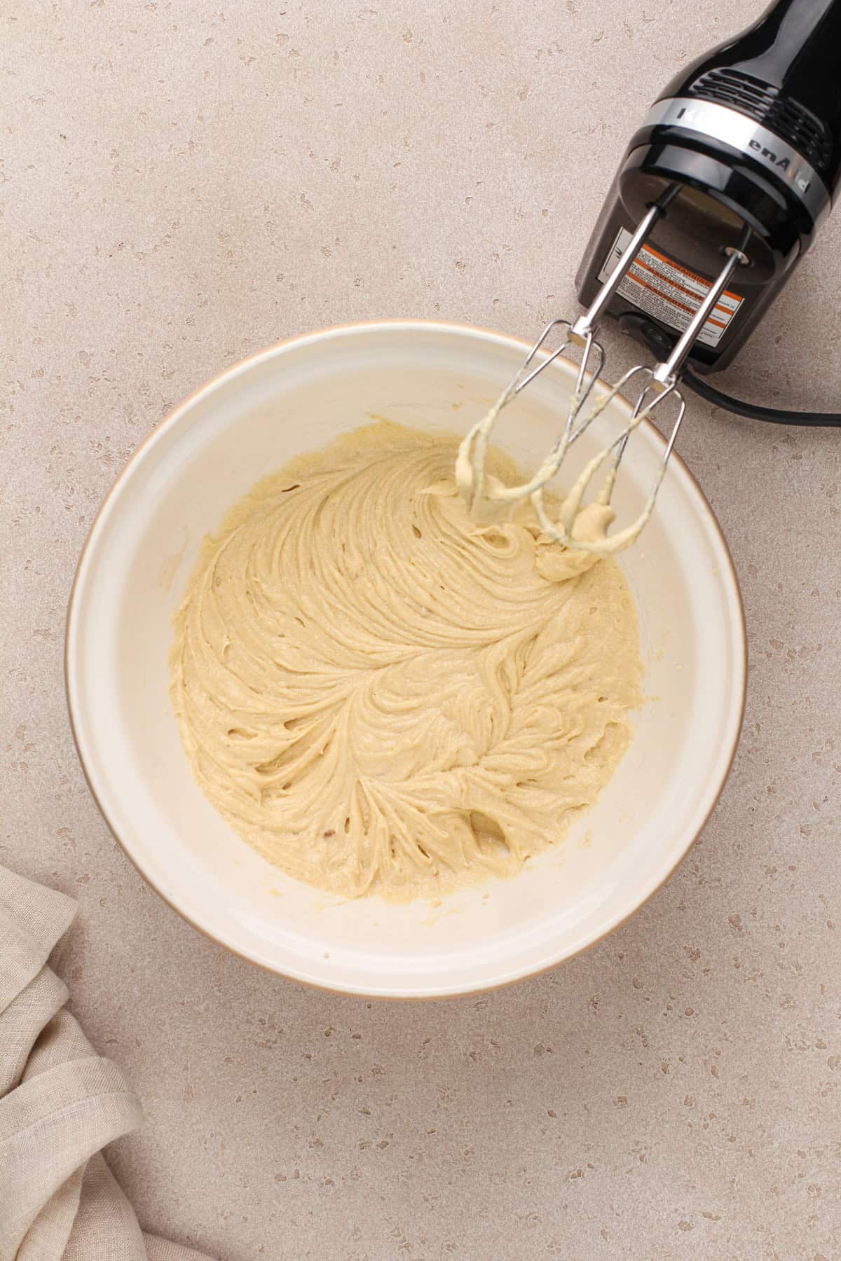 Wet ingredients for easy chocolate chip cookies mixed in a ceramic bowl.