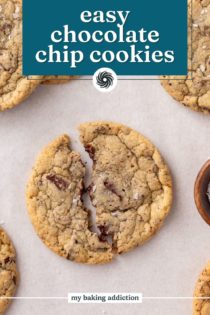 Easy chocolate chip cookie broken in half on a piece of parchment paper. Text overlay includes recipe name.
