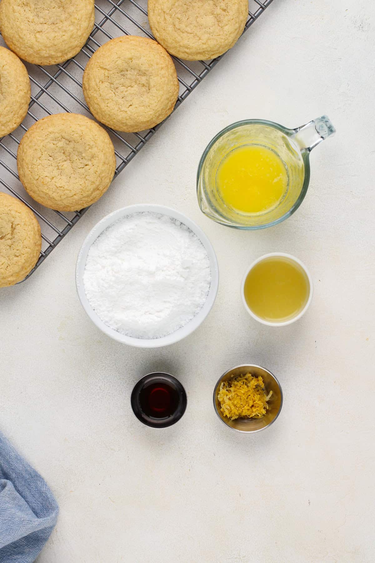 Lemon glaze ingredients arranged on a countertop.