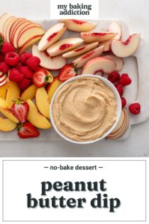 Overhead view of a bowl of peanut butter dip on a platter of assorted fresh fruit. Text overlay includes recipe name.