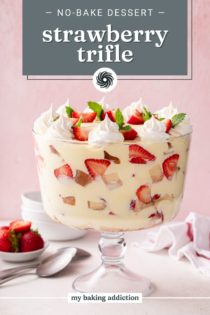 Side view of strawberry trifle in a trifle dish. Text overlay includes recipe name.