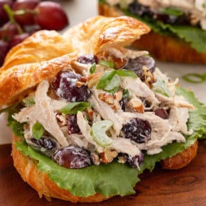 Close up of cranberry chicken salad on a croissant.