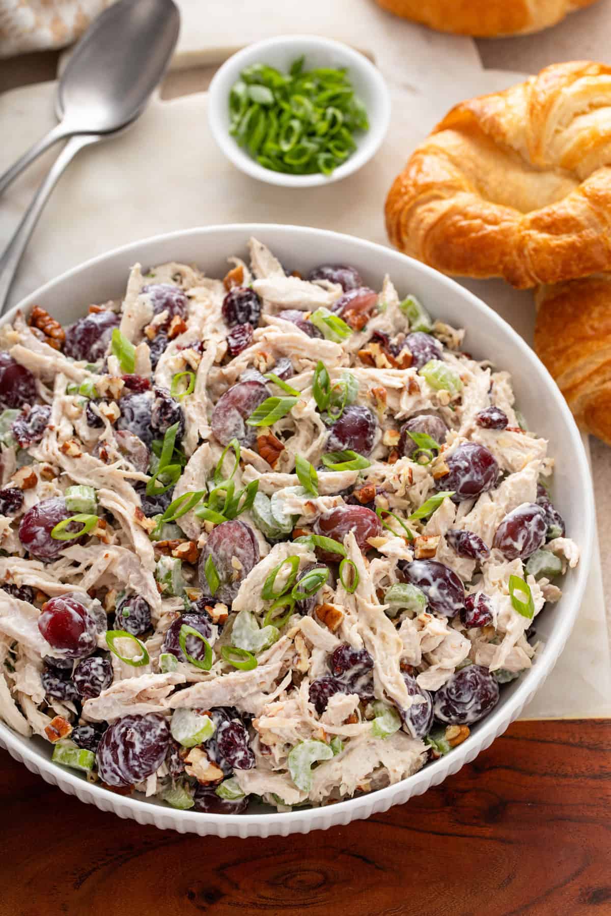 White serving bowl filled with cranberry chicken salad.