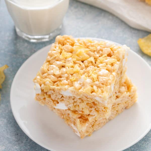 Two potato chip rice krispie treats on a plate.