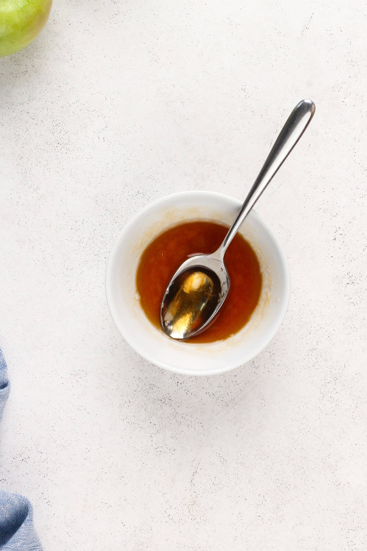 Melted apricot preserved in a white bowl.