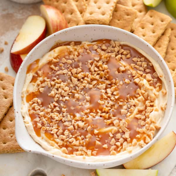 Close up of cream cheese caramel apple dip in a bowl.