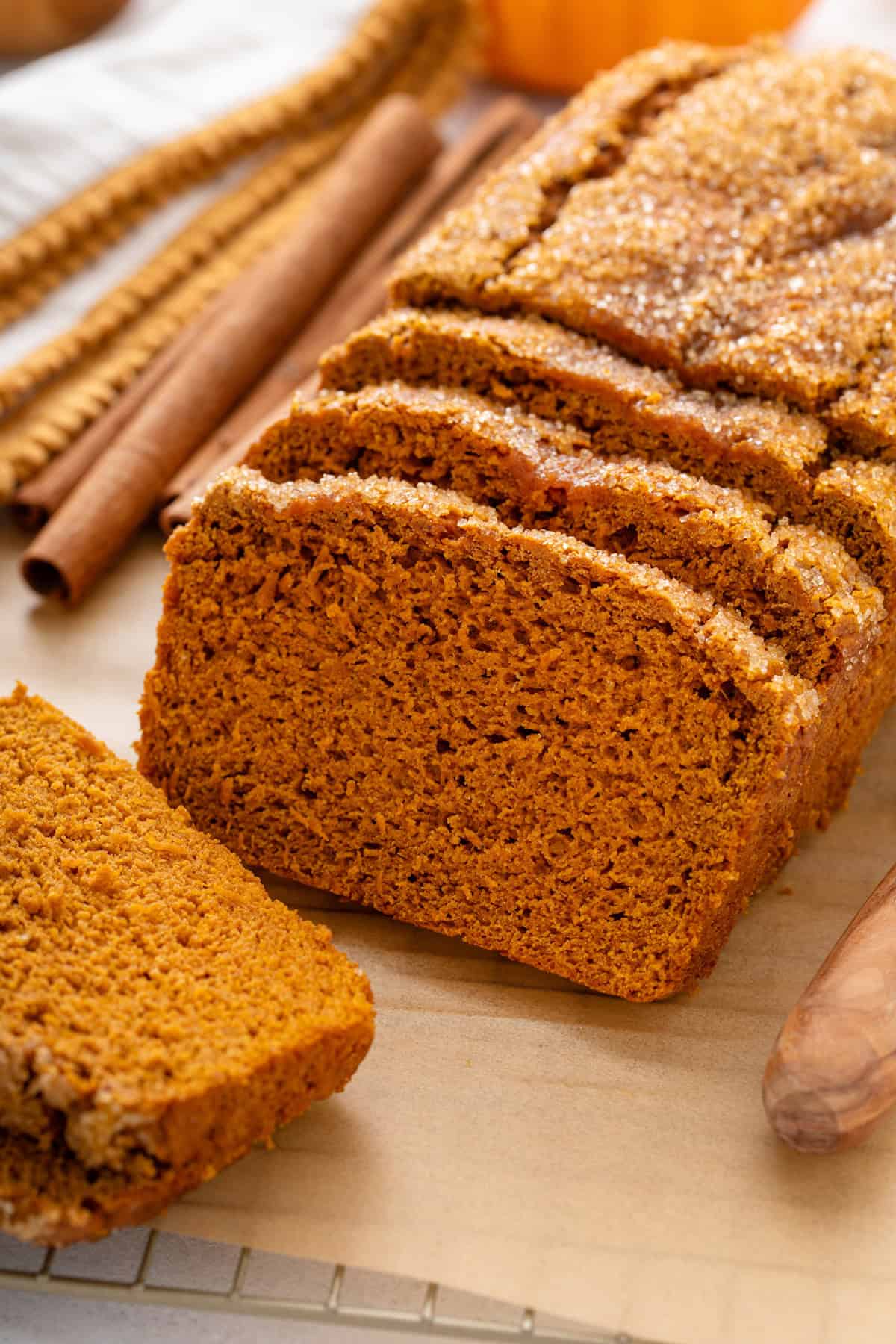 Close up of sliced 2-ingredient pumpkin bread on a piece of parchment.