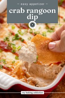 Hand scooping up crab rangoon dip with a wonton chip. Text overlay includes recipe name.