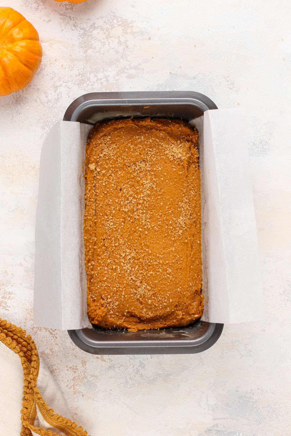 Unbaked 2-ingredient pumpkin bread in a loaf pan, ready to go in the oven.