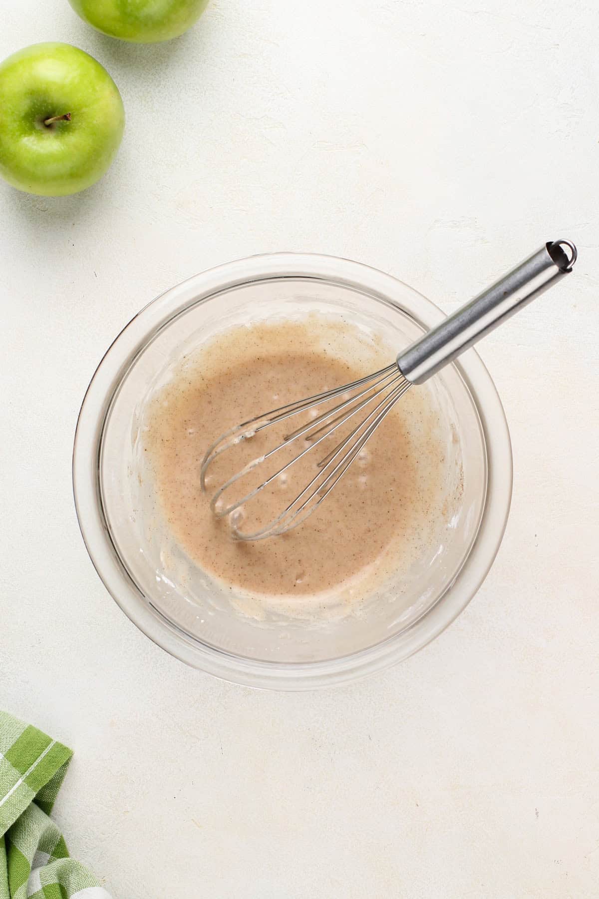 spiced vanilla glaze whisked together in a glass bowl.