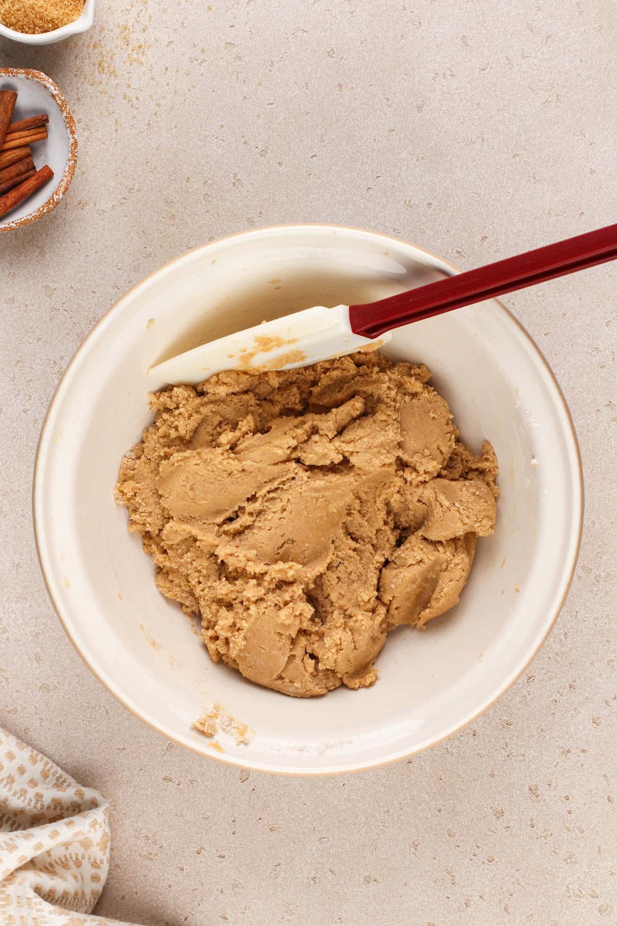 Brown sugar cookie dough in a white mixing bowl.