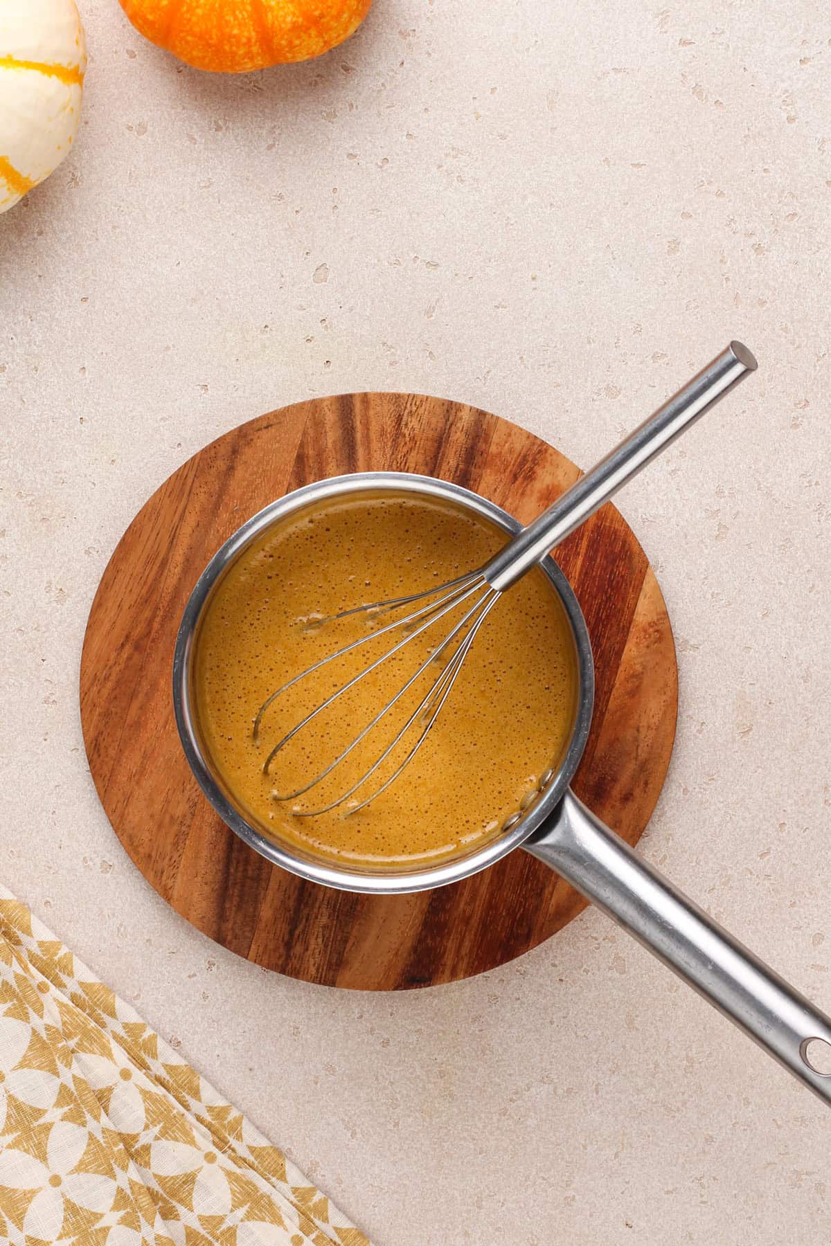 Pumpkin coffee syrup cooked and cooling in a saucepan.