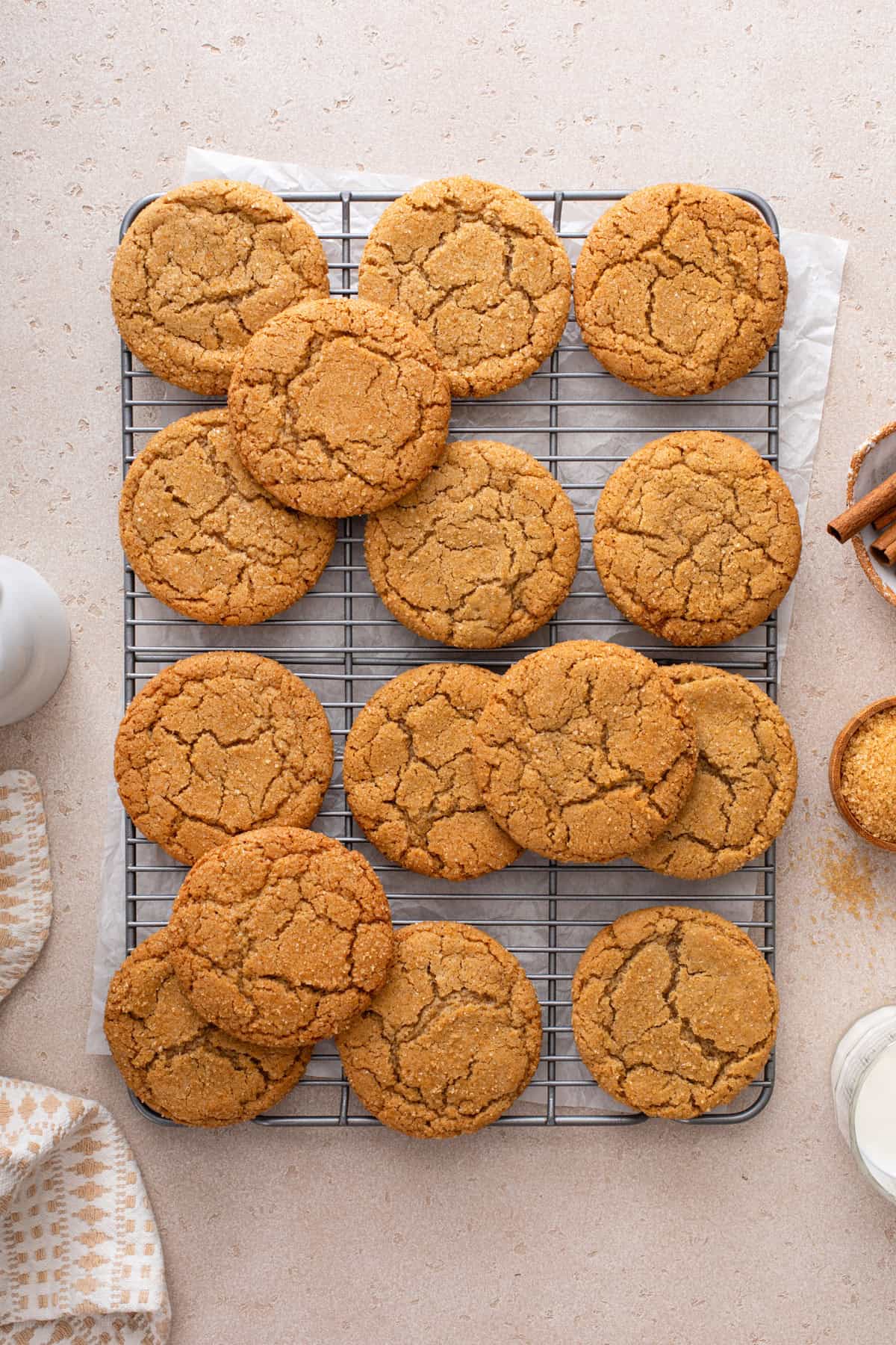 Overhead view of cinnamon and brown sugar cookies cooling on a rack.