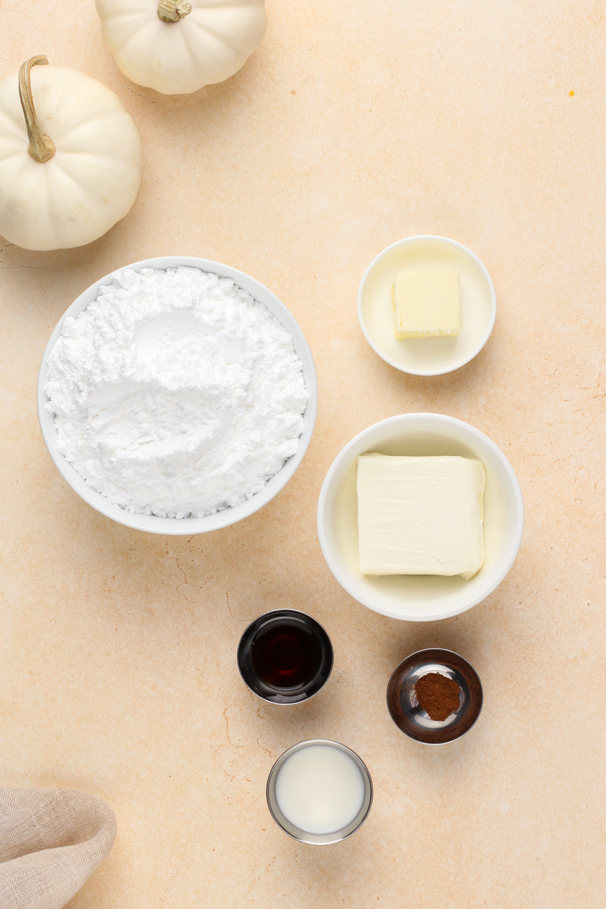 Cream cheese frosting ingredients arranged on a countertop.