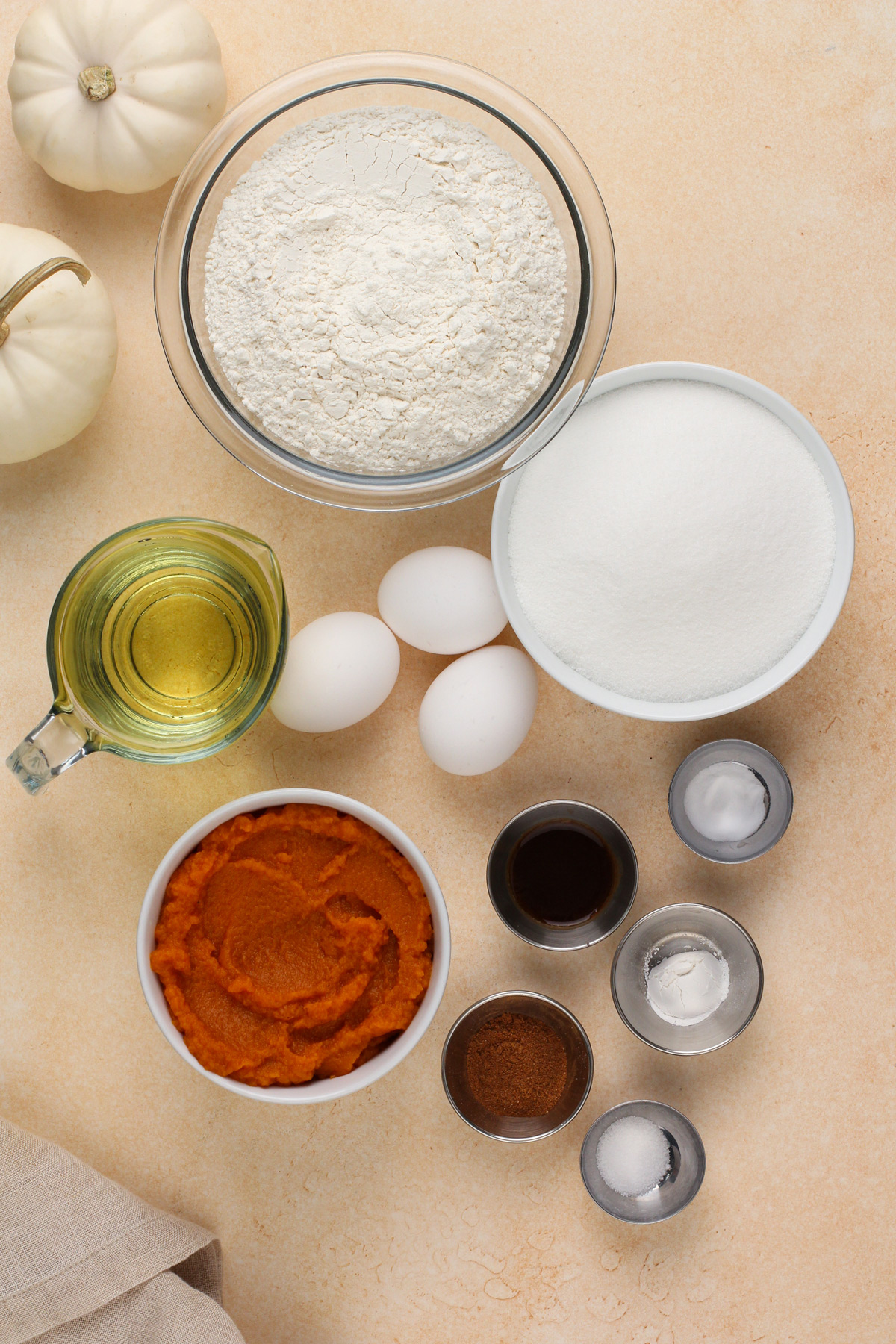 Ingredients for pumpkin sheet cake on a countertop.