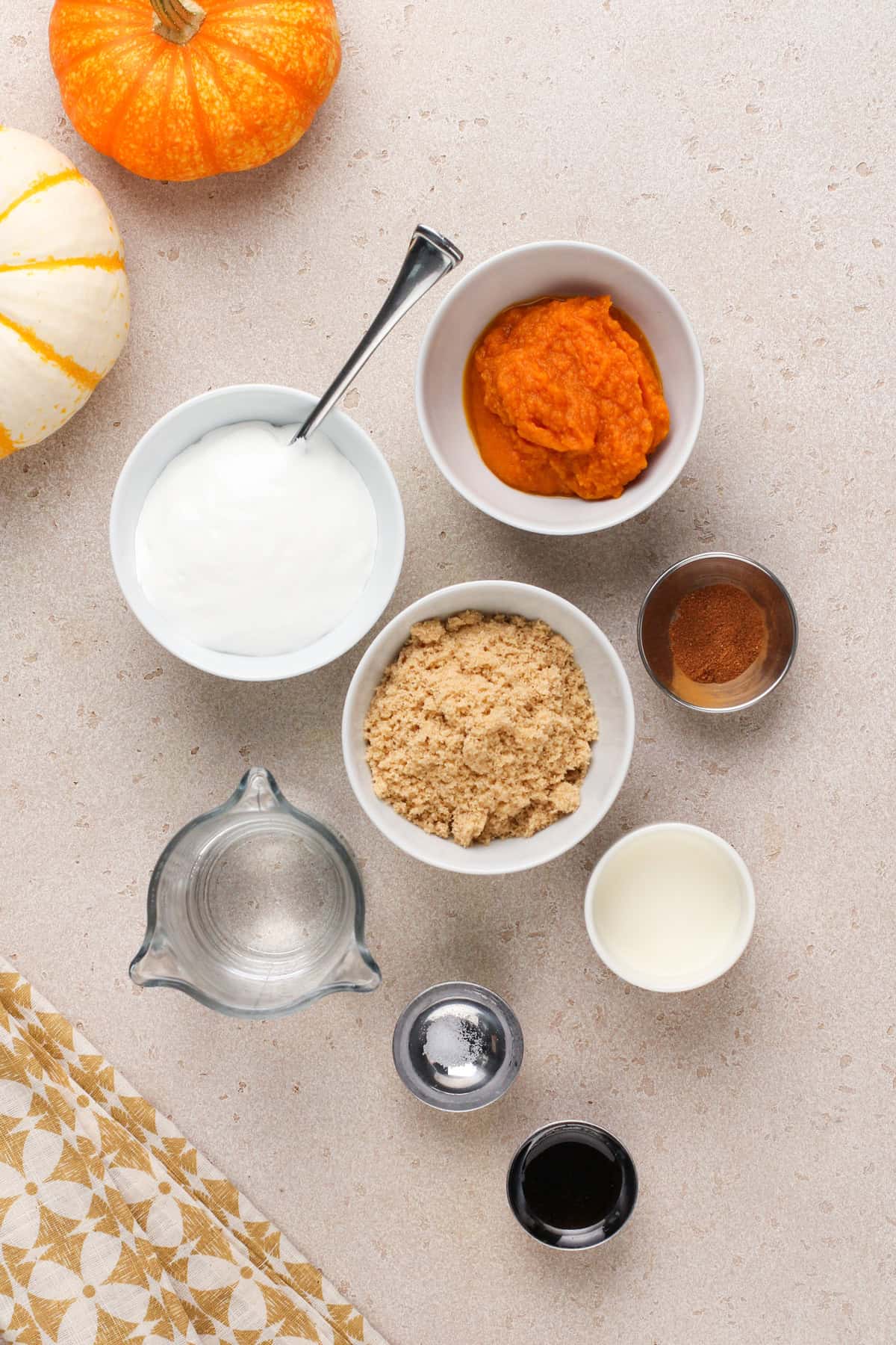 Ingredients for pumpkin coffee syrup on a countertop.