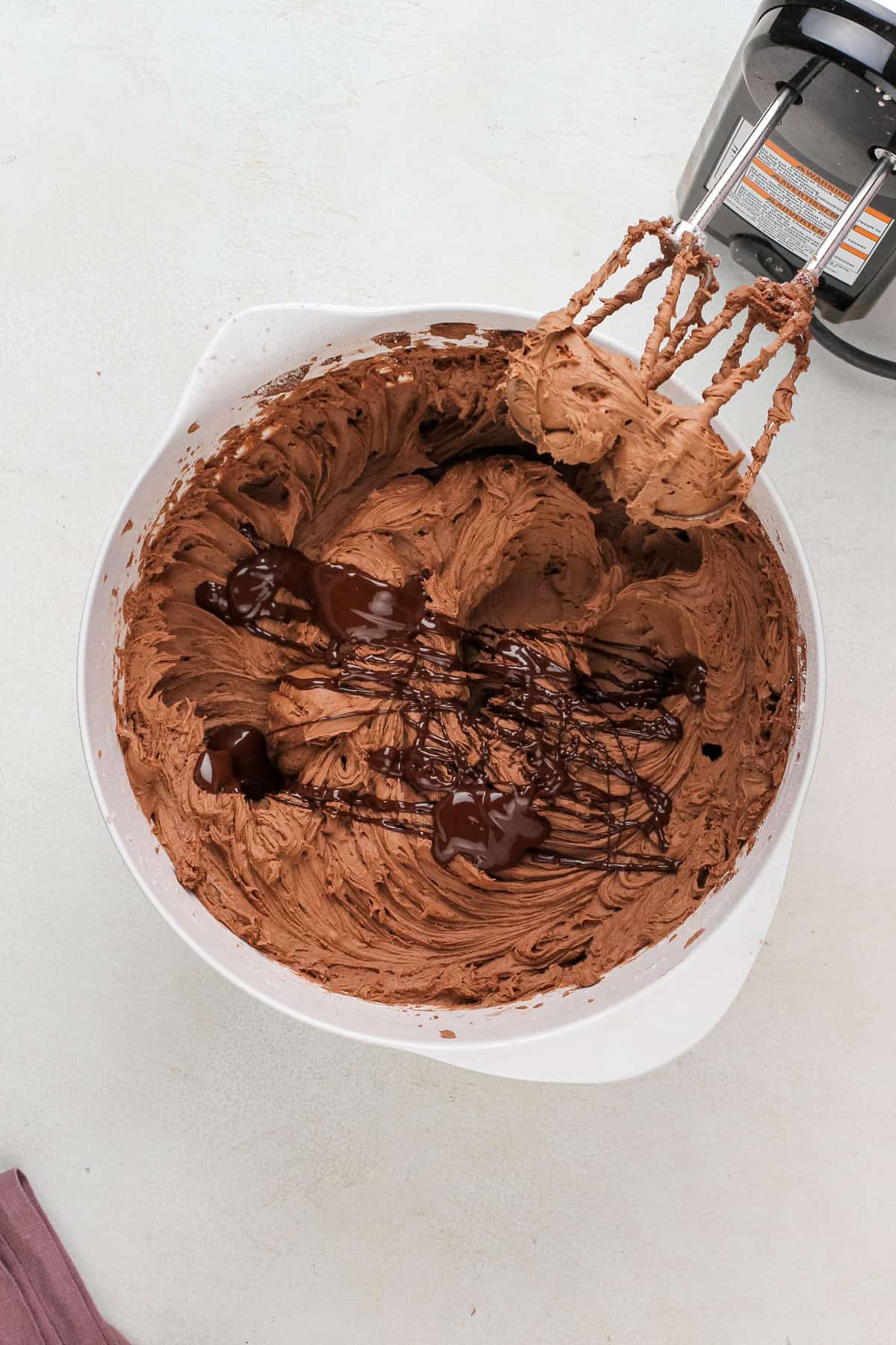 Melted chocolate drizzled into chocolate buttercream.