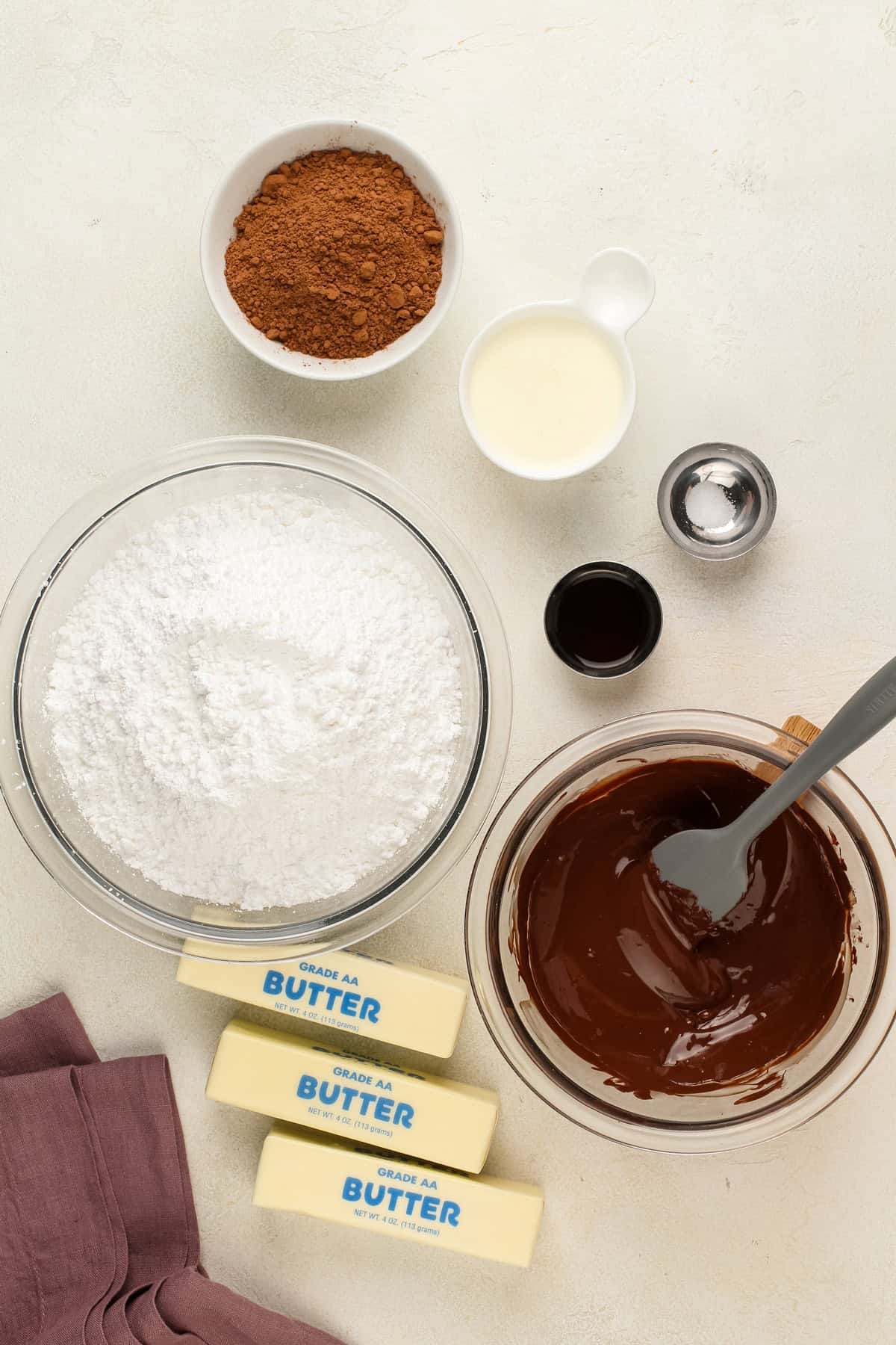 Ingredients for chocolate buttercream arranged on a countertop.