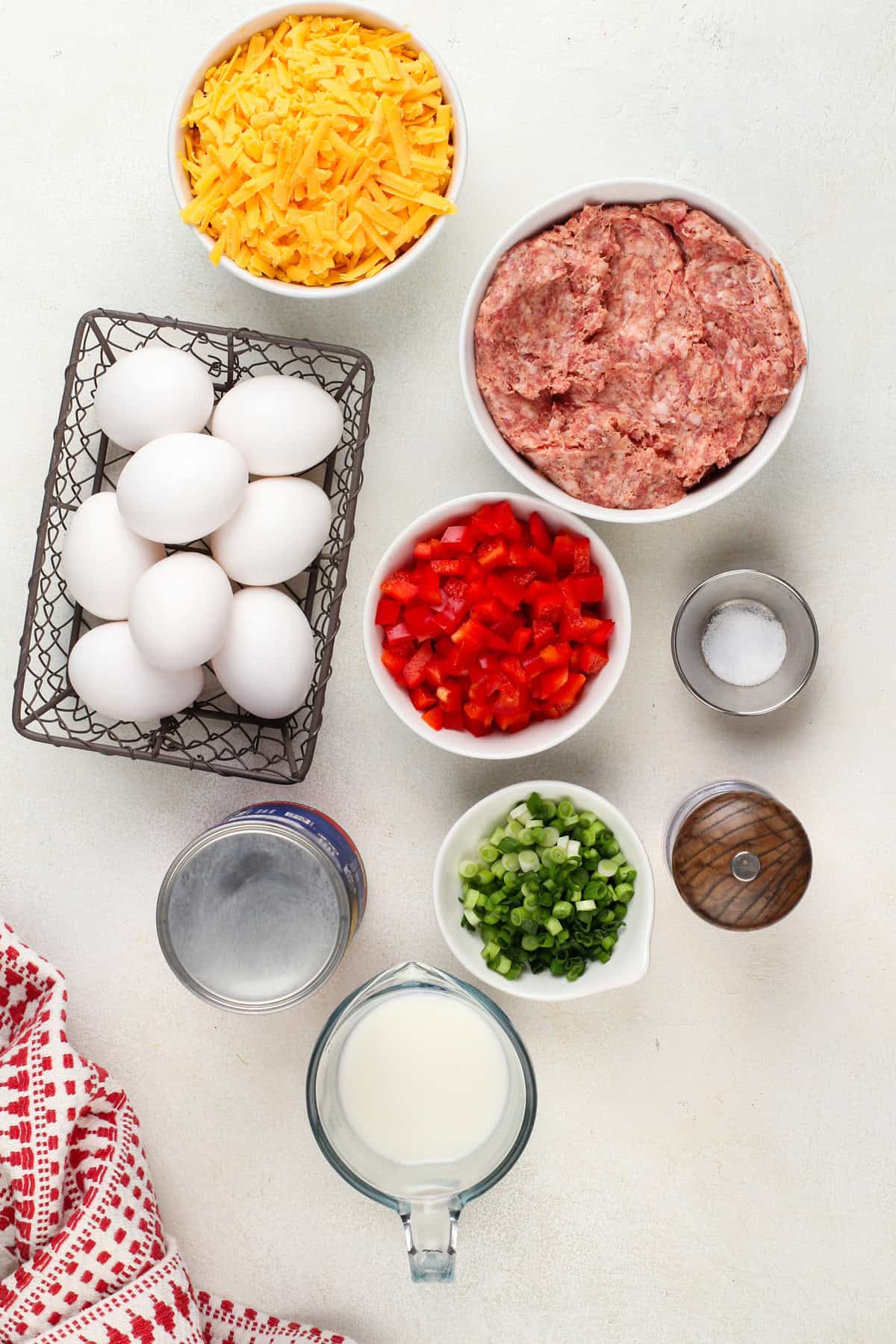 Ingredients for christmas breakfast casserole arranged on a countertop.