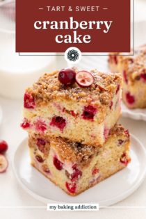 White plate holding two slices of stacked cranberry cake. Text overlay includes recipe name.