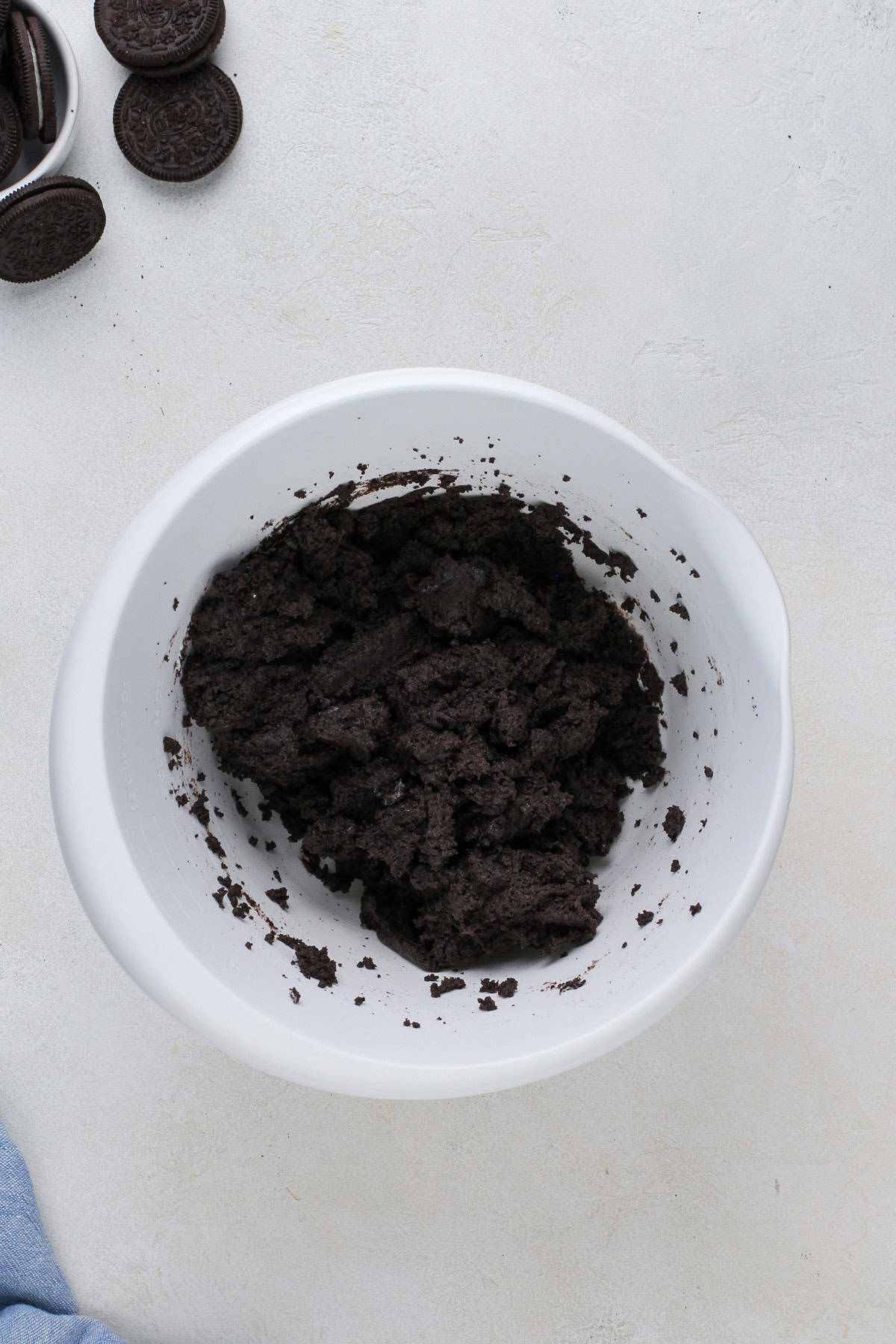 Dough for oreo truffle filling in a white bowl.