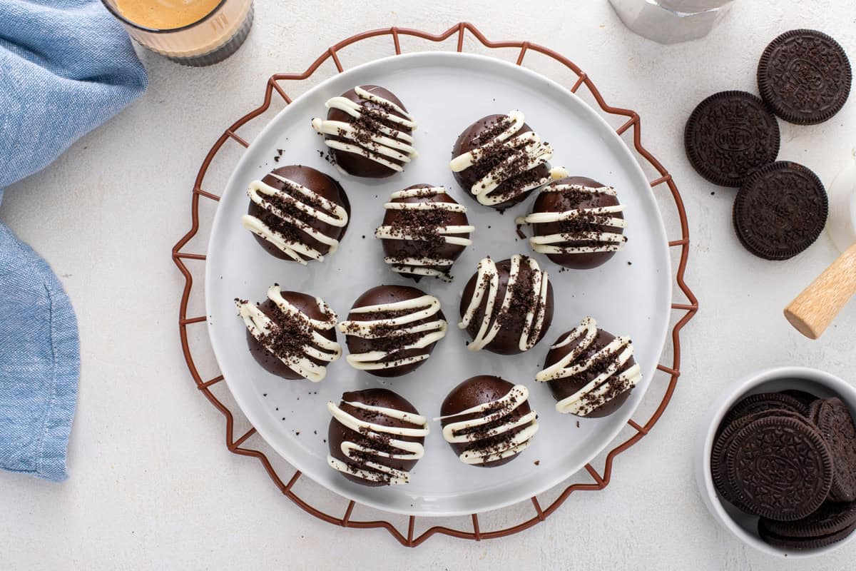 Overhead view of a white plate filled with oreo truffles.