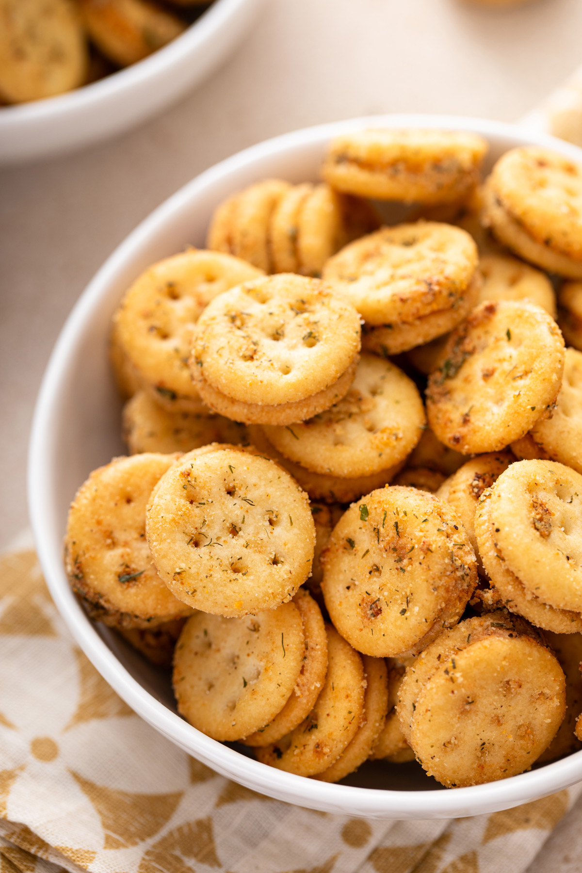 White bowl filled with ranch crackers.