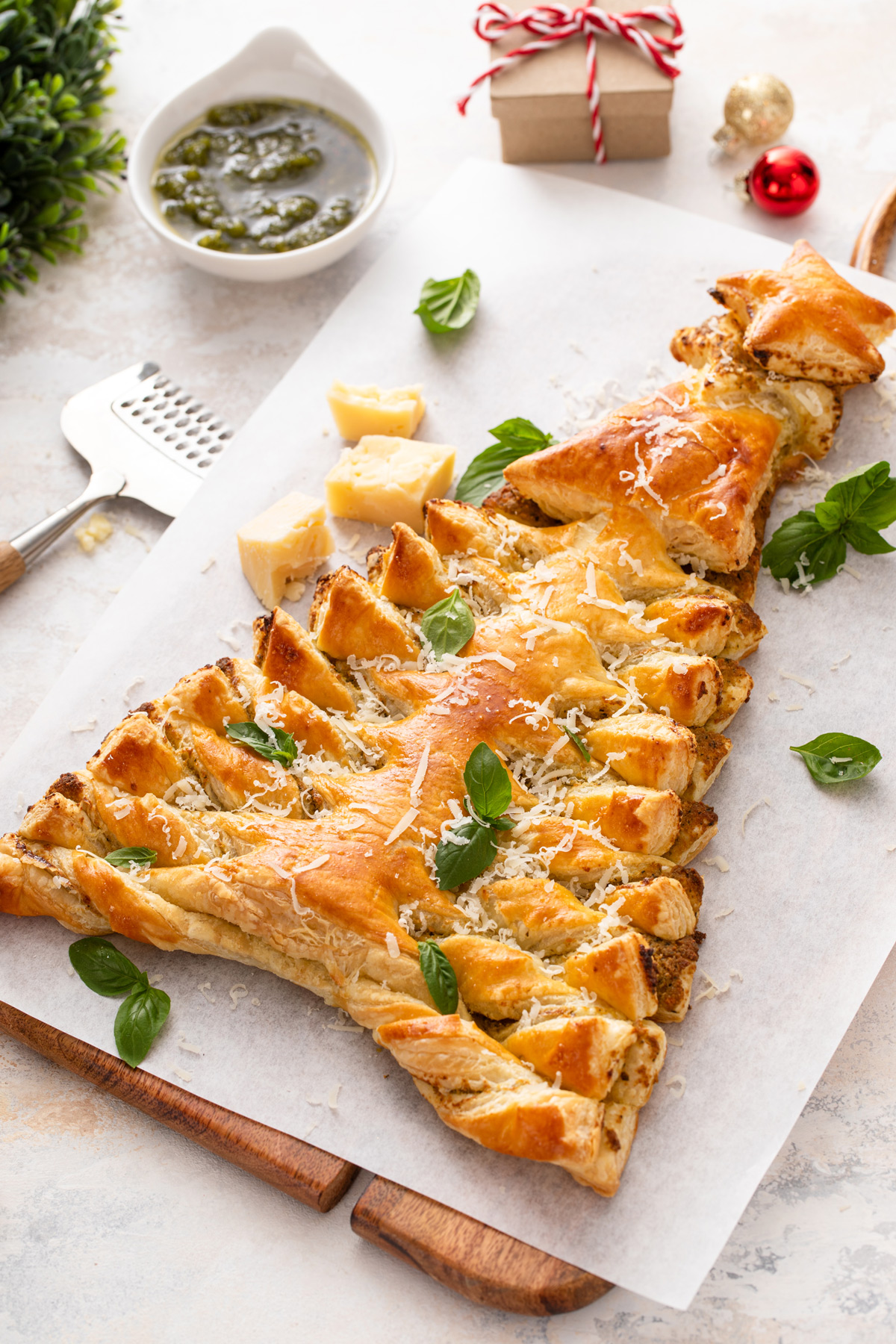 Savory puff pastry christmas tree filled with basil pesto.