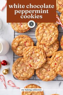 Overhead view of white chocolate peppermint cookies arranged on a wire rack. Text overlay includes recipe name.