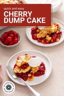 Two white plates of cherry dump cake topped with whipped cream. Text overlay includes recipe name.