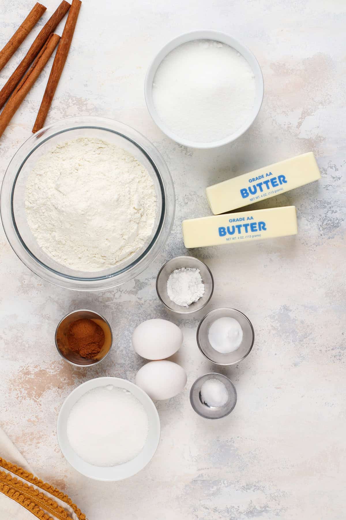 Ingredients for brown butter snickerdoodles arranged on a countertop.