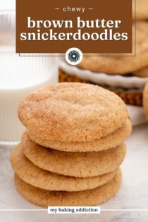 Close up of 5 brown butter snickerdoodles stacked on a countertop. Text overlay includes recipe name.