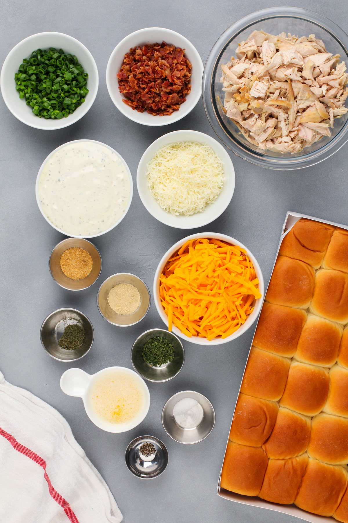 Ingredients for chicken bacon ranch sliders on a gray countertop.