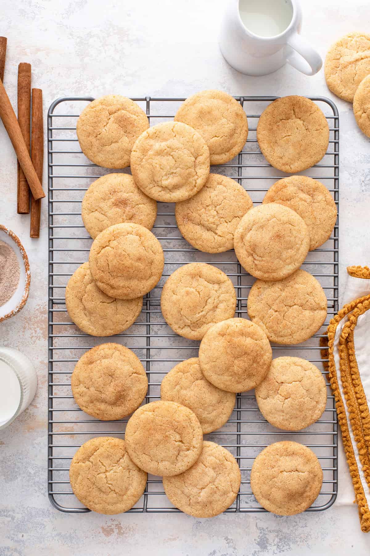 Overhead view of brown butter snickerdoodles cooling on a wire rack.