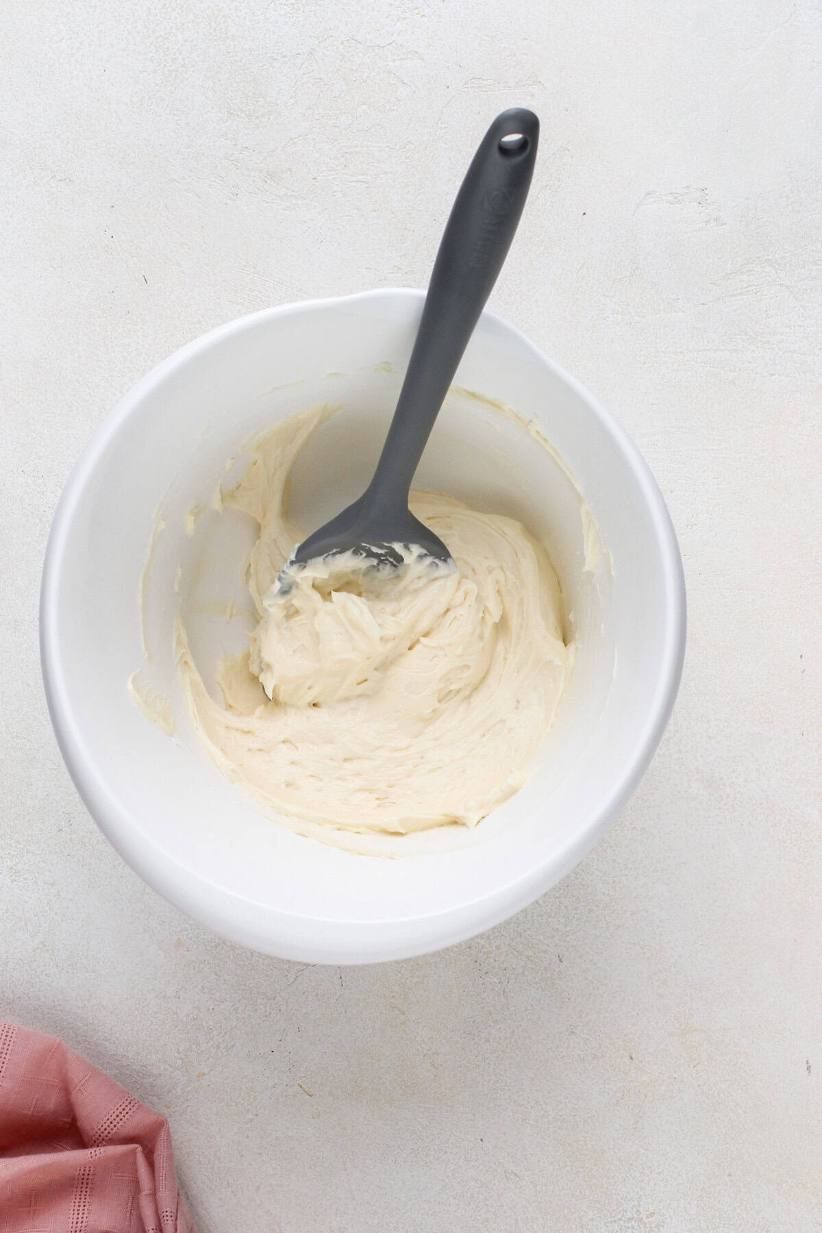 Cream cheese filling for puff pastry danishes in white bowl.