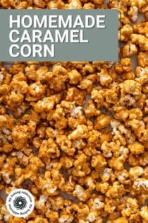 Close up image of homemade caramel corn spread on a baking sheet. Text overlay includes recipe name.