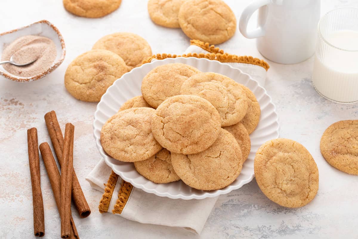 Brown butter snickerdoodles arranged on a white plate.