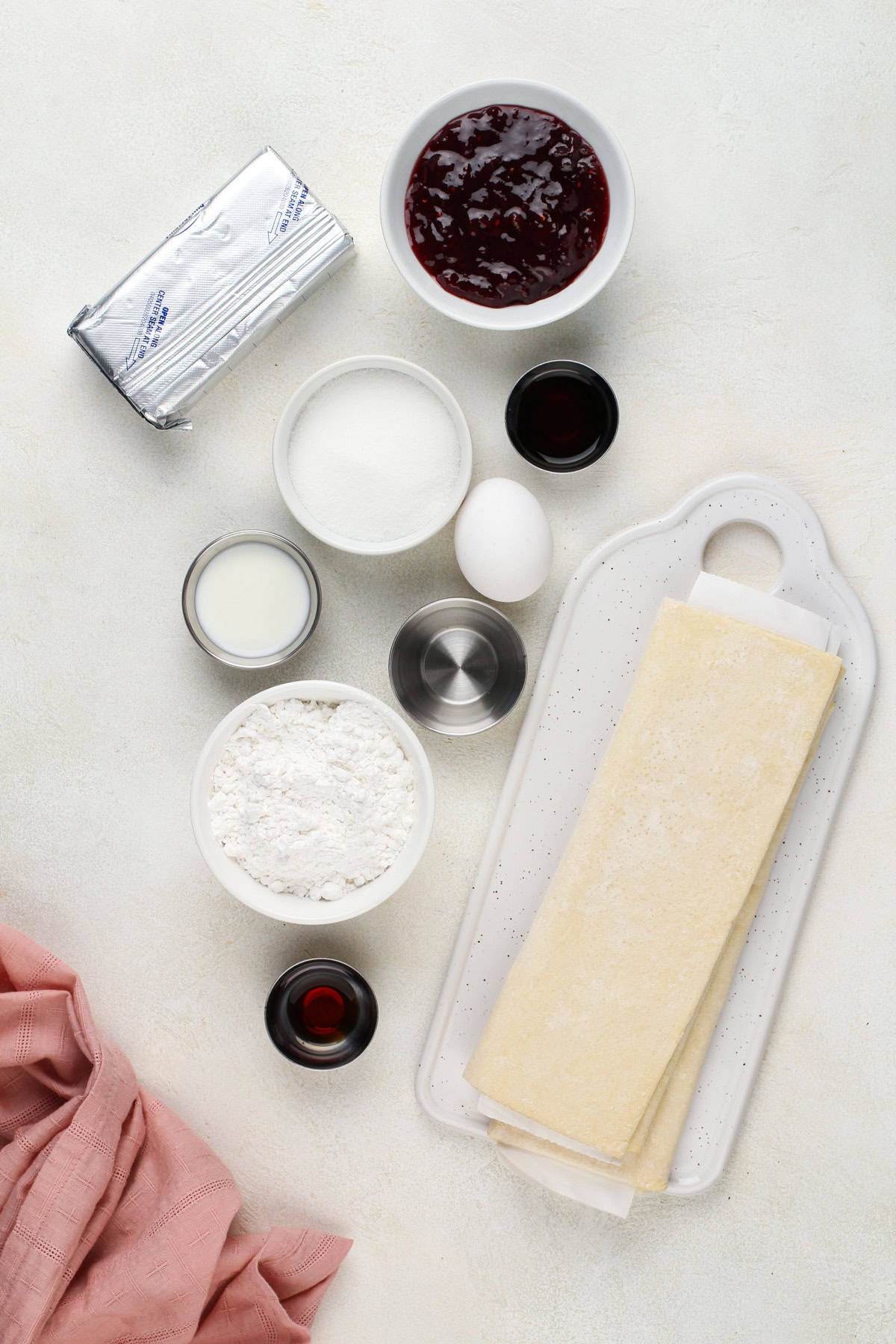 Ingredients for puff pastry danish arranged on a countertop.