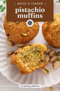 Three pistachio muffins on a white plate with a bite taken from one. Text overlay includes recipe name.