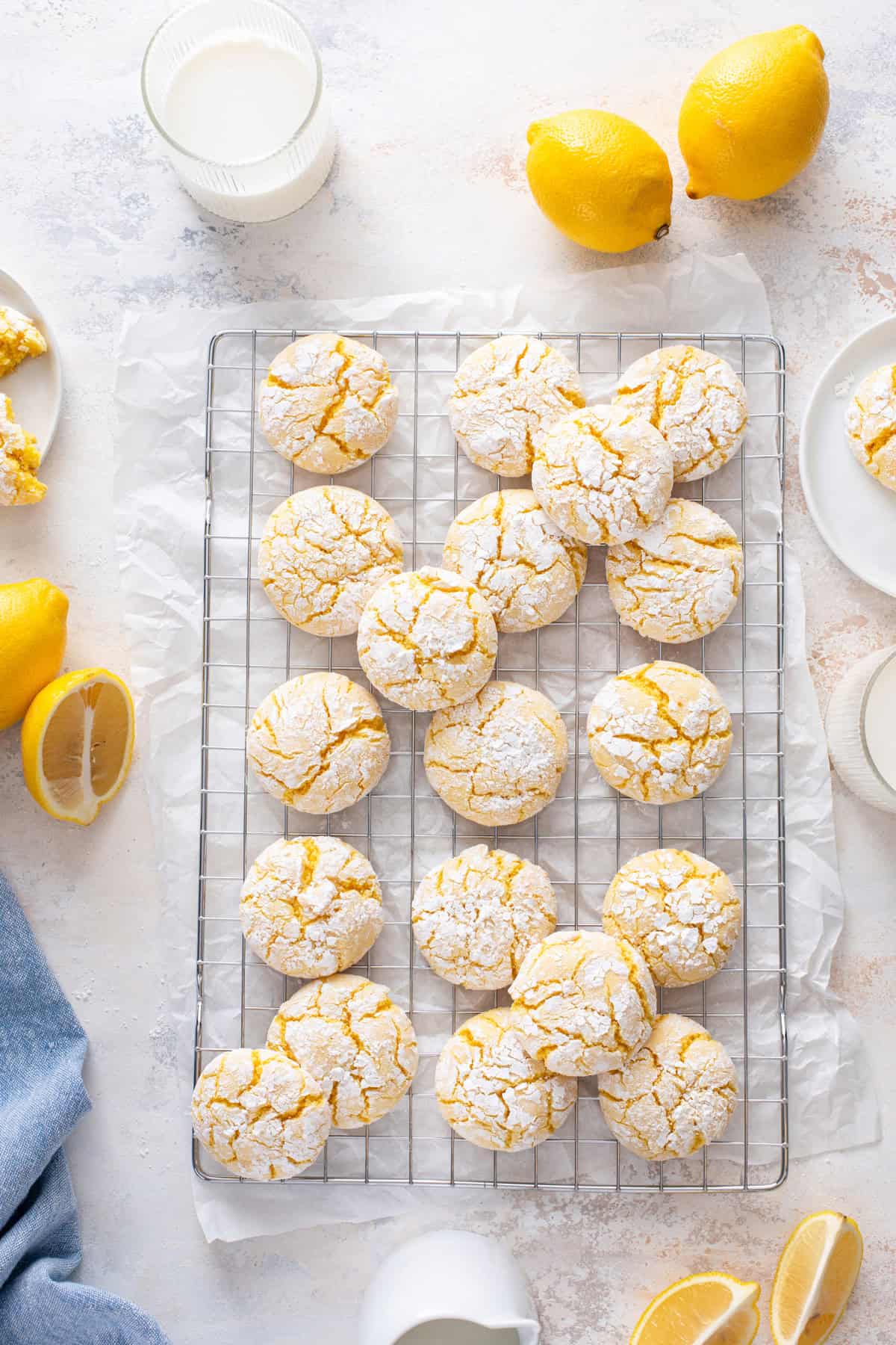 Overhead view of lemon crinkle cookies cooling on a wire rack.