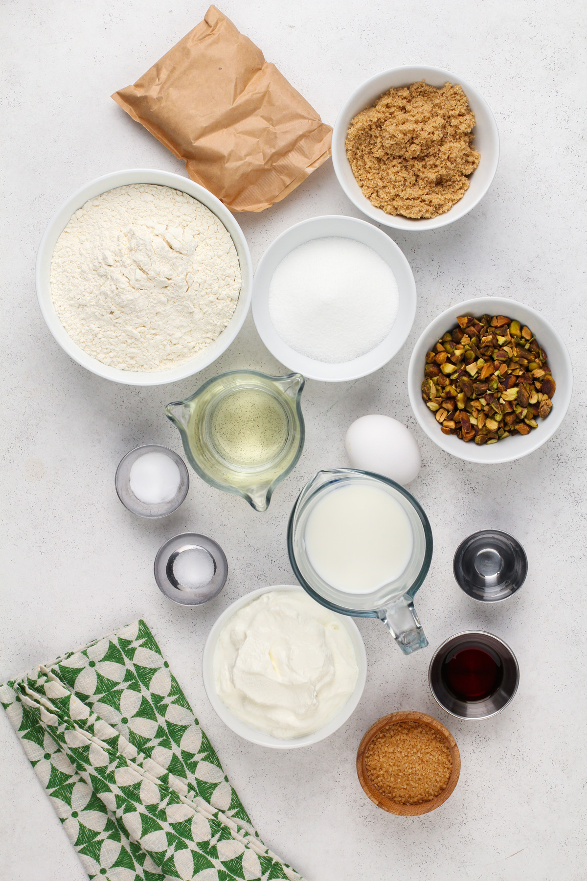 Ingredients for pistachio muffins arranged on a countertop.