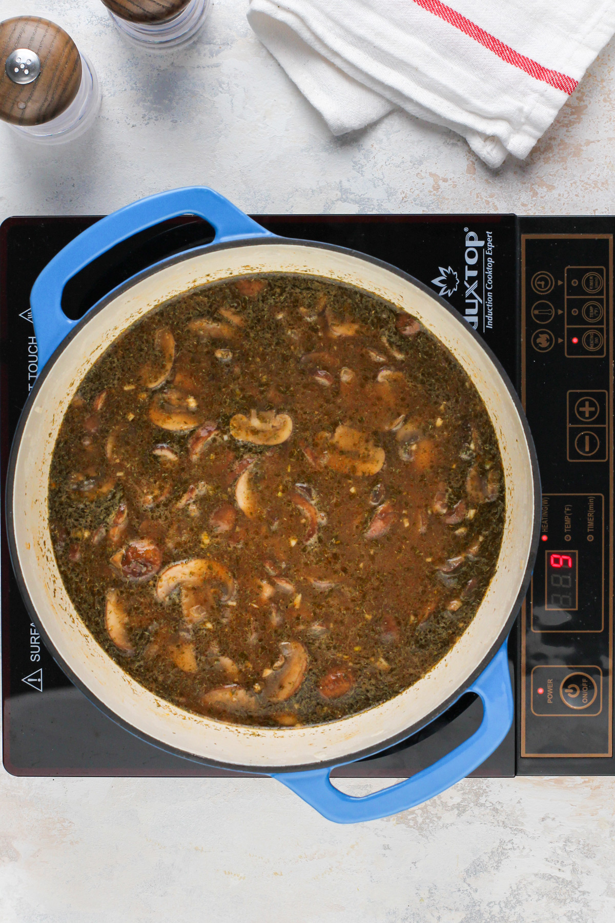 Mushroom soup simmering in a dutch oven.