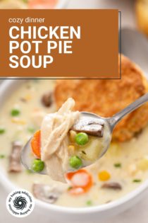 Spoon holding up a bite of chicken pot pie soup. Text overlay includes recipe name.