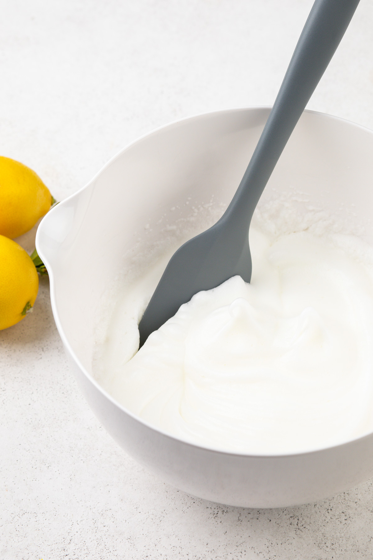 Beaten egg whites in a mixing bowl.