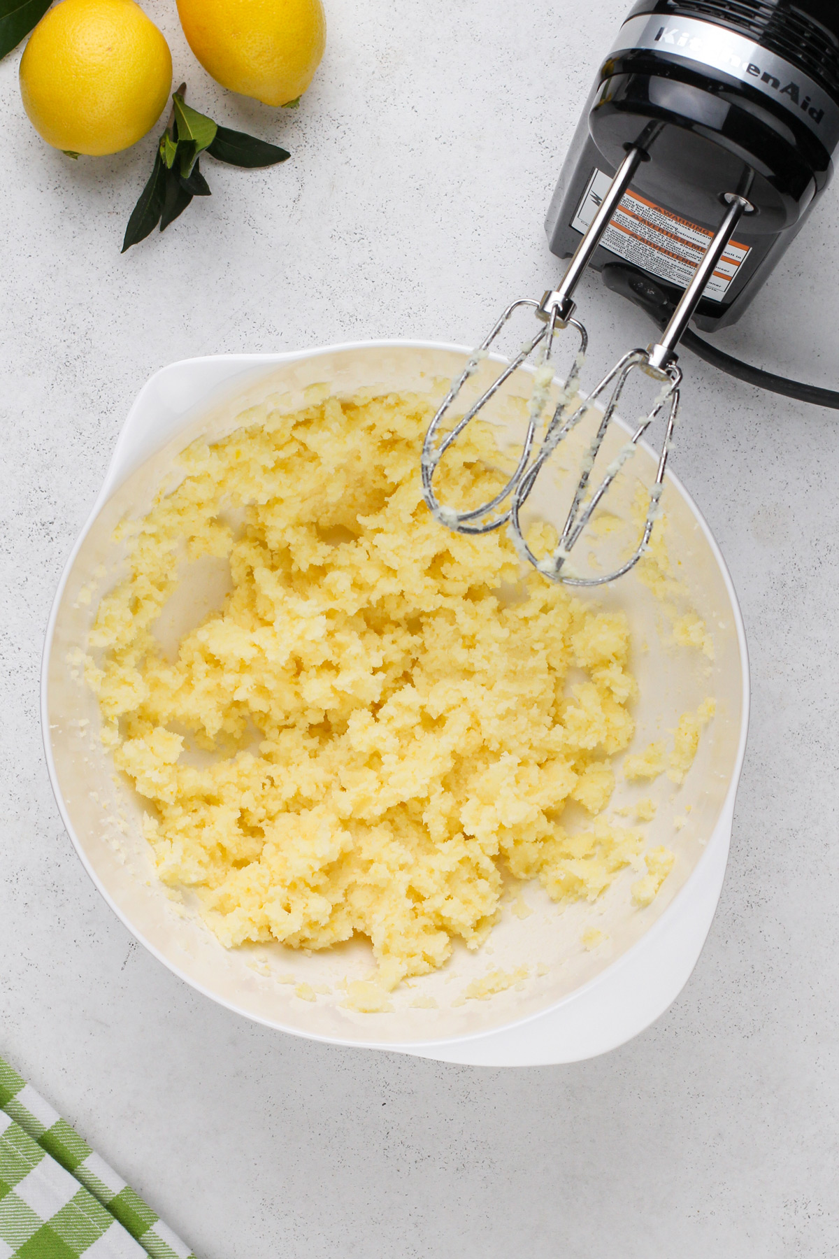 Creamed butter and sugar in a white bowl.